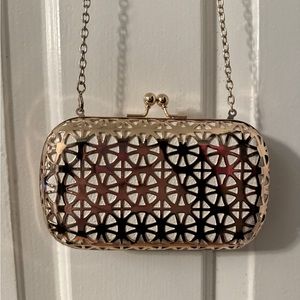 Big Buddha rose gold toned metal clutch